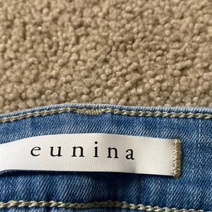 Light wash with frayed hem and zippers